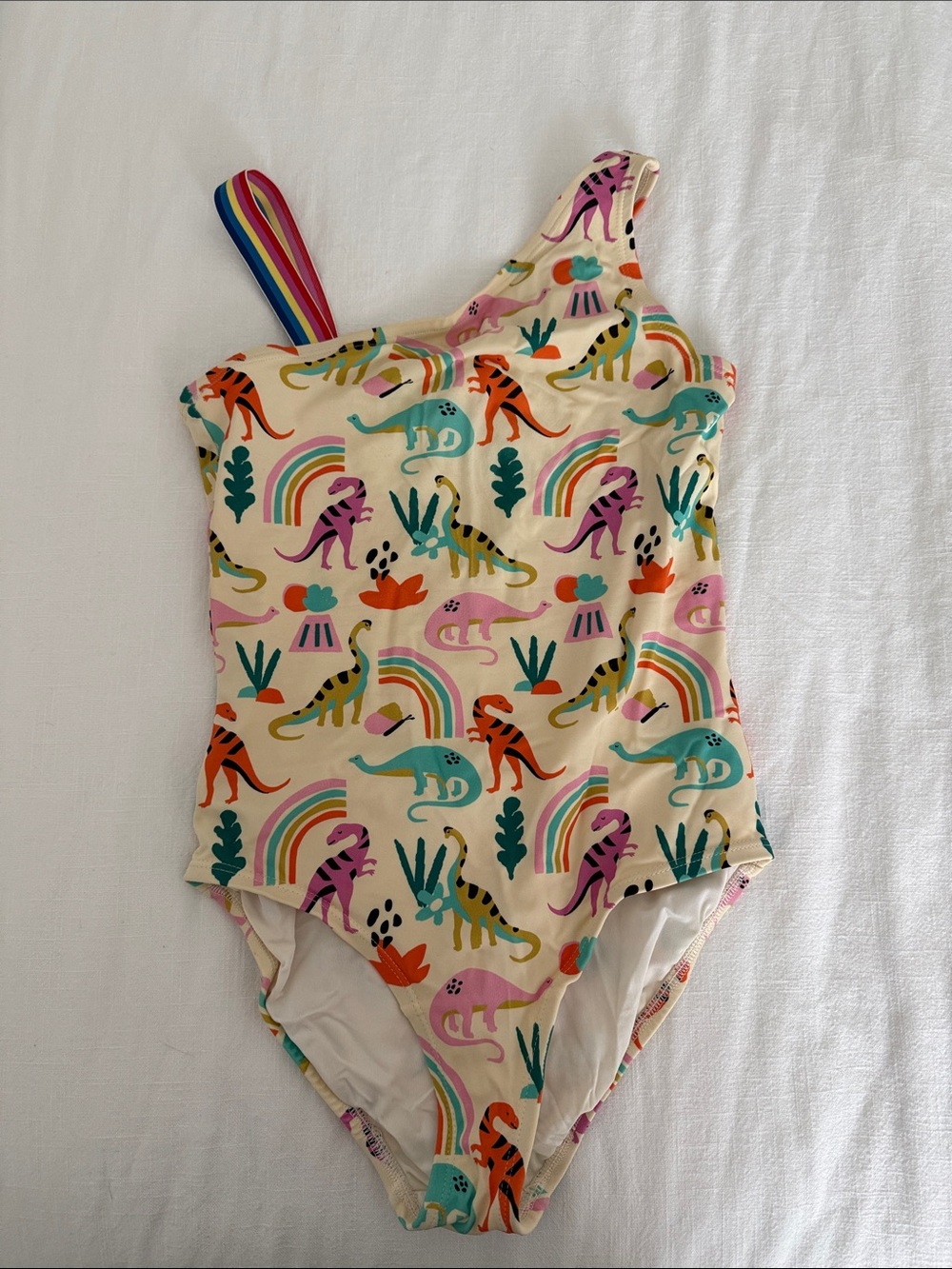 Girls One-Shoulder Dino & Rainbow Swimsuit - Cream Background